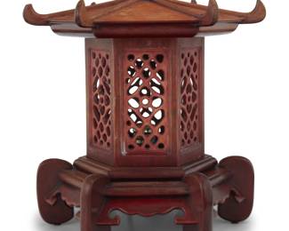 1309 An Asian style pagoda table lamp Late 20th century The single light within an openwork hexagonal shade, electrified 14.25" H x 12.5" Dia. Estimate: $200 - $400
