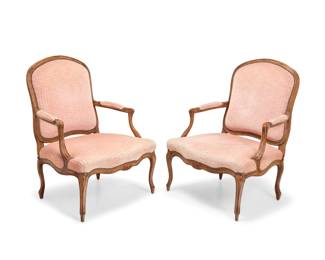 1192 A pair of Louis XV style walnut fauteuils 20th century elements Upholstered chairs in pink velvet fabric with brass tacking 2 pieces Each: 43.75" H x 34" W x 32.5" D Estimate: $200 - $300