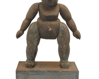 1362 A carved wood guardian figure Likely Japanese, 20th century Depicting a stylized standing human form with simplified features Figure: 43" H x 34" W x 13" D; Plinth: 12.5" H x 32.25" W x 15.25" D Estimate: $600 - $800