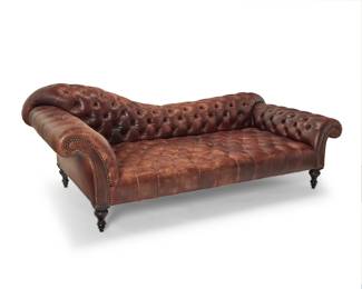 1106 A George Smith tufted leather chaise Late 20th century With metal tag: GEORGE SMITH / HANDMADE BY CRAFTSMEN / NEWCASTLE ENGLAND With brass tacking 34" H x 95" W x 44" D Estimate: $500 - $700