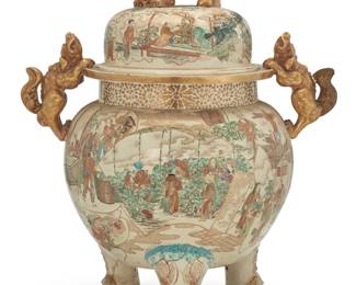 1348 A Japanese polychrome and gilt enameled ceramic censer Meiji/Taisho Era (1868-1926) Decorated in the Kutani/Satsuma style depicting figural tableaus, with gilt figural handles and lid finial, raised on three legs 23.75" H x 19.375" W x 14.5" D Estimate: $500 - $700