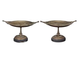 1125 A pair of French patinated bronze tazzas Late 19th/early 20th century One with incised signature: SALMSON Each depicting a maiden in low relief at center of bowl, raised on a stone base 2 pieces Each: 6.625" H x 11.625" W x 8" D Estimate: $400 - $600