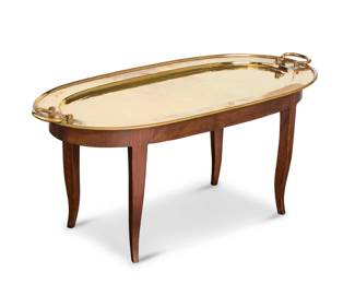 1110 A William Van Erp brass oval tray top coffee table Mid-20th century With 'open box' windmill mark: HANDWROUGHT / DIRKVANERP / SAN FRANCISCO With opposed handles, raised on a later custom wood table base Table: 16.5" H x 35.75" W x 15.375" D; Tray: 39.25" W x 18.25" D; Overall: 17.5" H Estimate: $300 - $500