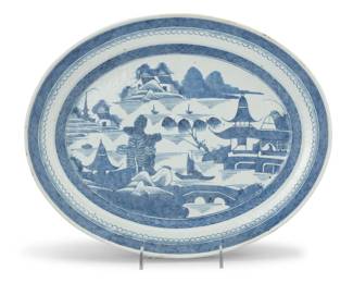 1292 A Chinese blue and white porcelain platter 20th century Depicting a seaside town 1.75" H x 15" W x 11.875" D Estimate: $200 - $300
