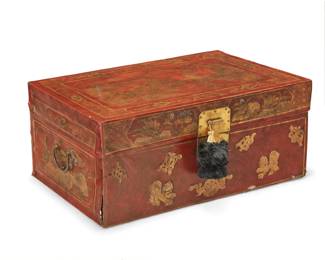 1263 A Chinese pig chest Late Qing Dynasty (1644-1912) or later The red lacquered pigskin chest with brass hinges and latch lock, featuring gilt floral decorations to side and the top depicting a landscape scene with a fisherman in a boat 13" H x 29.5" W x 21.75" D Estimate: $100 - $200