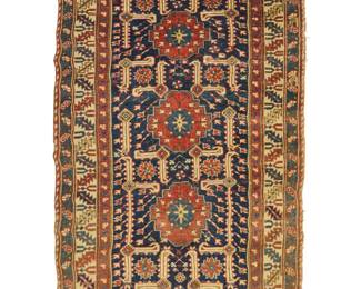 1373 A Caucasian rug Early 20th century Wool on wool foundation 5' 5" L x 3' 5" W Estimate: $500 - $700