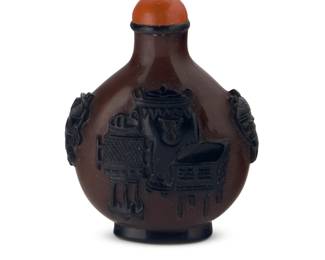 1275 A Chinese overlaid glass 'One Hundred Antiques' snuff bottle 19th/20th century Depicting various antique objects 2.5" H x 1.875" W x 1" D Estimate: $200 - $400