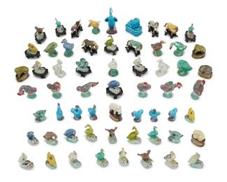 1279 A large group of miniature Chinese glazed pottery figures 20th century Comprising ducks, geese, elephants, horses, and various other animals, most with wood stands 60 pieces approximately Tallest: 4.5" H x 3" W x 2.25" D Estimate: $400 - $600