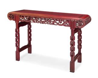 1316 A Chinese carved rosewood altar table 20th century The apron carved with openwork tree branches and birds 32.25" H x 48.75" W x 15" D Estimate: $300 - $500