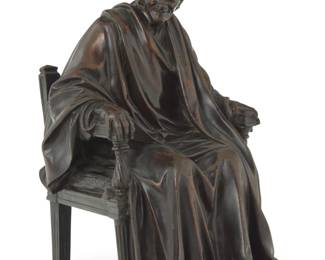 1076 A French patinated bronze figure of Voltaire After the model by Jean-Antoine Houdon (1741-1828), 19th century Unmarked 7" H x 4.5" W x 5.625" D Estimate: $200 - $400