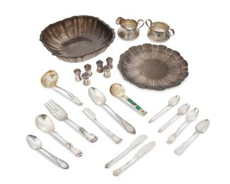 1002 A collection of sterling silver table items 19th/20th century Each marked for sterling and various makers Comprising a tray, bowl, open sugar, creamer, and various utensils 23 pieces Tray: 10" Dia.; Bowl: 2.625" H x 11.375" W x 10.5" D Total weight: 57.5 gross oz. troy approximately Estimate: $1,500 - $2,000