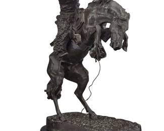 1074 After Frederic Remington (1861-1909) "The Bronco Buster," modeled 1895 Patinated bronze on marble base Edition: 1/10 Signed in the casting: Frederic Remington; impressed edition Bronze: 21.25" H x 16.75" W x 13" D; Overall: 22.25" H x 17.25" W x 14" D Estimate: $300 - $500