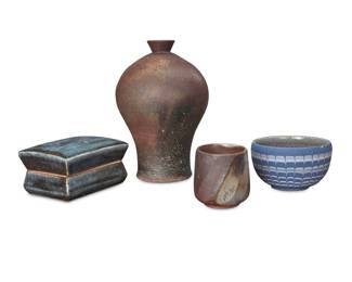 1360 Fifteen Japanese studio stoneware vessels Late 20th century Some housed in custom wood boxes, comprising: Cup by Fukuda Saiun Cup by Hayashi Kotaro Sake cup by Hoshino Teisai Teacup by Kagami Hideki Sake cup by Kamuguchi Guro Teacup by Kanzaki Tsuguhara Sake cup by Kato Takeshi Box and cover by Kawai Takeichi Vase and a tea bowl by Kikuchi Akira Pair of plates by Maeda Yoshio Bowl by Mochizuki Makoto Sake cup by Otani Shiro Sake cup by Shibata Takefumi Plate by Yamada Shinman 15 pieces Tallest: 9" H x 6.25" Dia.; Largest box: 10.75" H x 7.5" W x 7.5" D Estimate: $500 - $700