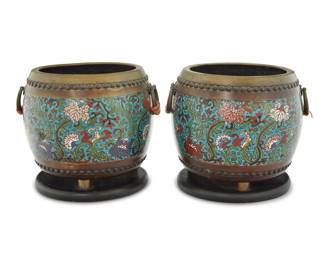 1256 A pair of Chinese cloisonné censers 20th century Each with opposed ring handles, raised on an enameled wood base 2 pieces Each overall: 10.25" H x 12.25" W x 11.25" D Estimate: $400 - $600