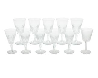 1009 A group of ten Baccarat glass 'Carcassonne' stems 20th century Each etched with factory marks; one marked for Waterford Comprising: 5 tall water goblets (7") 5 claret wine glasses (5.875") Together with one Waterford wine glass (6") 11 pieces total Estimate: $200 - $300