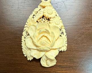 Carved Celluloid Pendant with Floral Motif