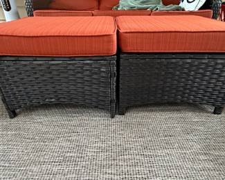 Pair of Wicker Outdoor Ottomans with Orange Cushions