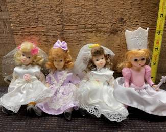 Three porcelin dolls plastic doll