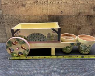 Wood wheel barrow with clay pots