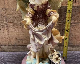 Angel carrying stars