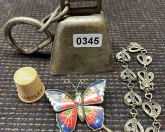 Cowbellbutterfly pin bracletthimble