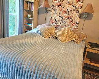 a view into the main bedroom, great comforter. bed is on riser and can be lowered