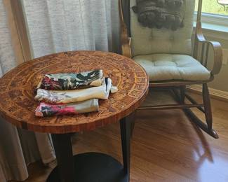 carved side table and vintage rocker