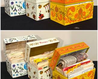A collection of vintage Avon metal recipe boxes from the 1970s