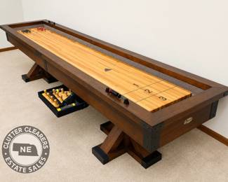 Legacy Billiards shuffleboard table with shuffleboard bowling accessories.