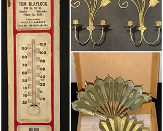 A vintage advertising thermometer for Tom Blaylock Monuments of Omaha, Nebraska. A vintage pair of HOMCO brass scroll and leaf wall sconce candle holders and a pair of vintage Homco "Romantique Fans" wall art decorations.