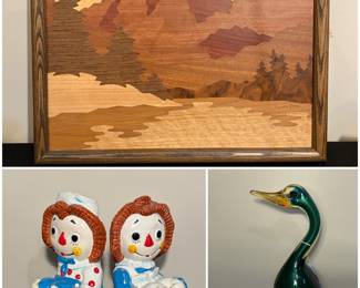 A framed wooden marquetry wall art, signed by artist Lynne Buss. Vintage Raggedy Ann and Andy chalkware bookends and a vintage Murano art glass duck figurine, and a Ken Edwards Tonala pottery owl.