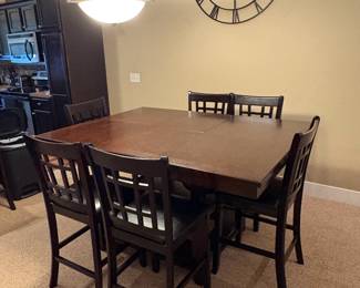 Counter height expandable table with storage  and 8 chairs