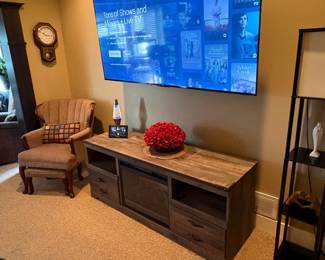 75" wall mounted TCL tv, electric fireplace console with remote, wing back chair with footstool (set of 2).