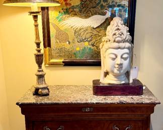 Buddha Head on Marble Chest of Drawers