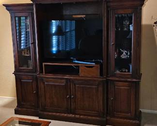 Entertainment Center $125. Dimensions-- side pieces 17 3/4 inches deep, 18 1/4 inches wide and 70 1/4 tall. Middle piece 24 inches deep, 42 1/2 inches wide and 70 1/4 inches tall. (Items inside are not included)