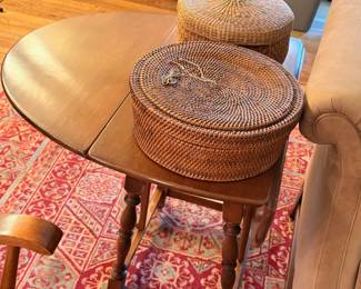 Gate leg side table in maple.  Hand woven baskets