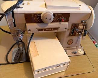 Singer sewing machine in cabinet