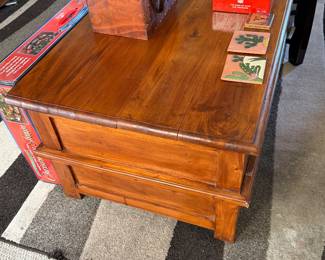 rustic, honey-toned solid wood multi-drawer coffee table