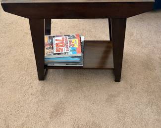 Dark brown espresso wood end table featuring a clear glass top