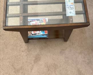 Dark brown espresso wood end table featuring a clear glass top