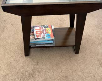 Dark brown espresso wood end table featuring a clear glass top