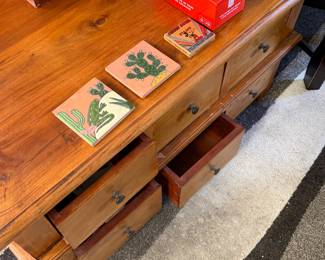 rustic, honey-toned solid wood multi-drawer coffee table