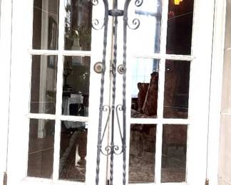 Tall wrought iron stand with copper plant holder.