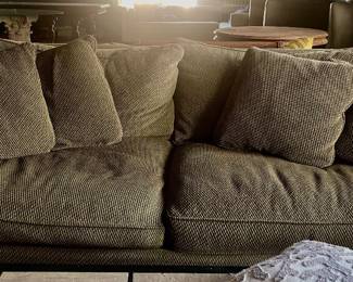 Upholstered sofa with pillows