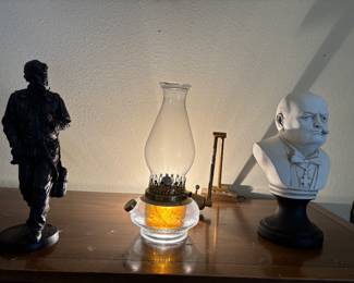 Winston Churchill sculpture and y pique hurricane lamp 