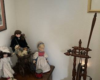 2 different antique spinning wheels and old dolls
