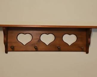 Wooden Shelf with Heart Cutouts and Pegs