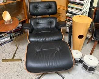 'Eames' black leather lounge chair and ottoman; West Elm 'Charley C' side table side