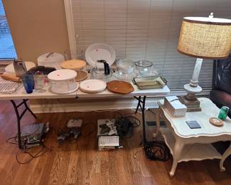Kitchen supplies, end tables, lamp, and gaming systems