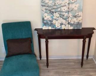 Wooden Console Table With Green Upholstered Chair With Throw Pillow And 3panel Floral Wall Decor